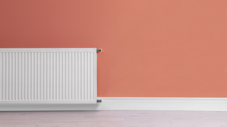Coral wall with white radiator
