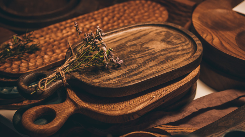 Handmade cutting boards and vintage wooden dishes.
