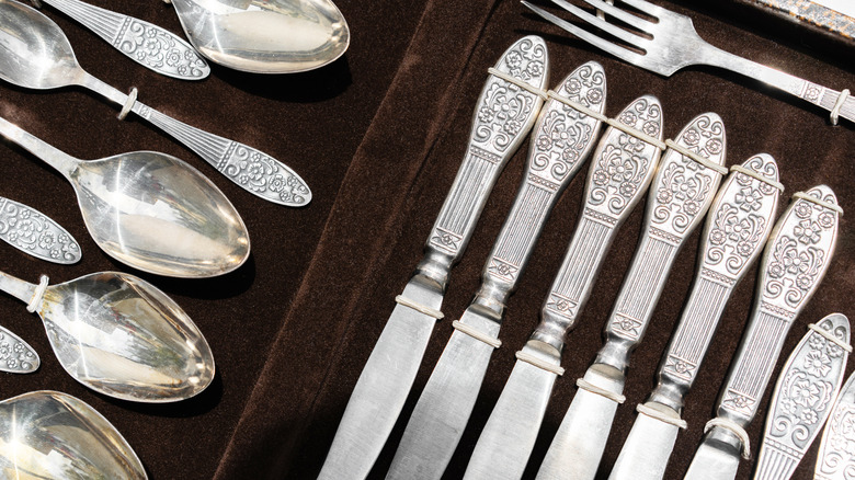 Vintage cutlery in a box. Spoons, forks and knives.