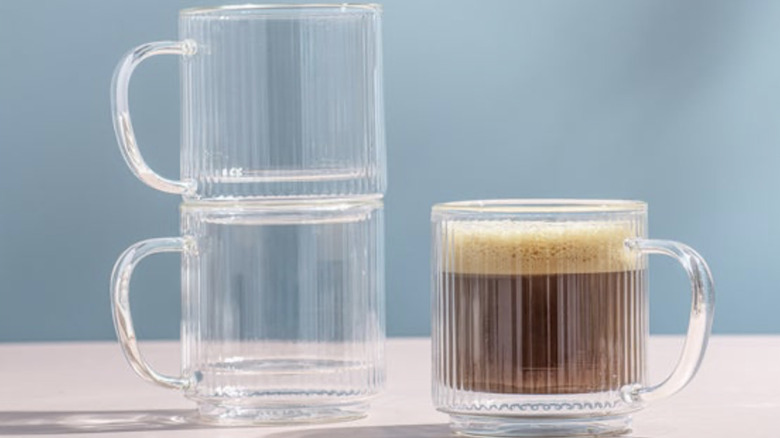 Fluted clear glass mugs with coffee inside