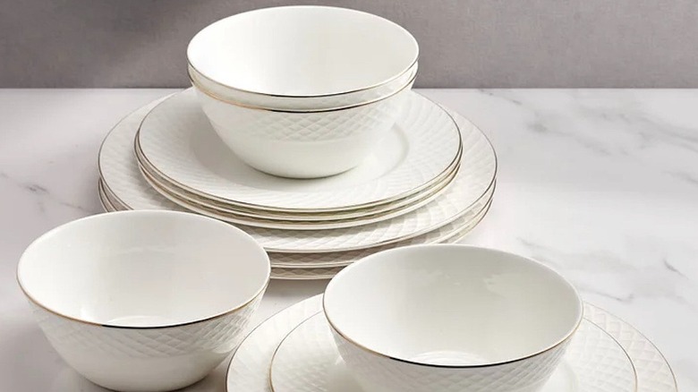 White china dishes with gold rim