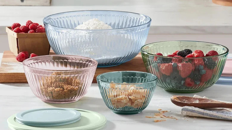 Multi-colored glass mixing bowls with fruit and cereal inside