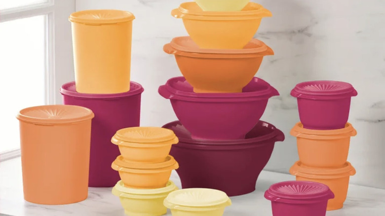 Retro-inspired Tupperware set in shades of pink, yellow, and orange