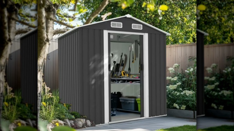 The dark gray ZImtown shed in a back yard.