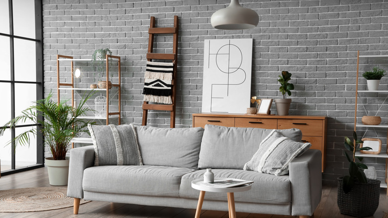 A beautiful living room with ladder-style shelving in the background