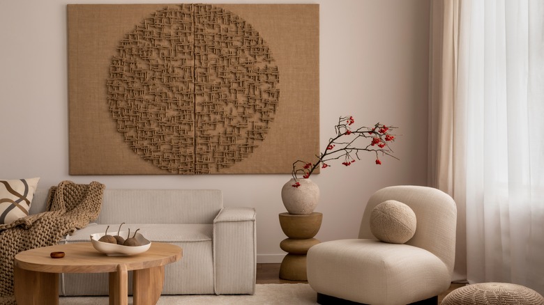 tan textured artwork above couch