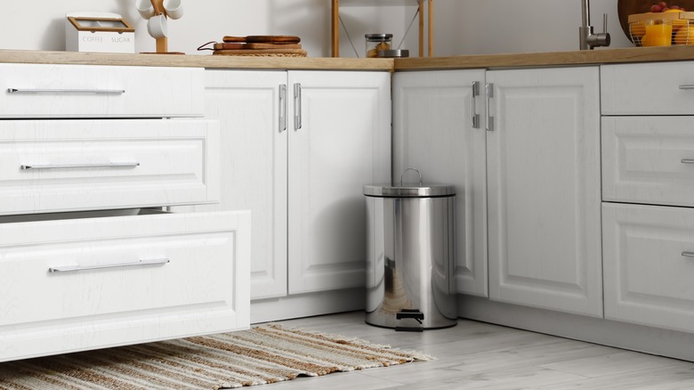 Trash can in kitchen corner