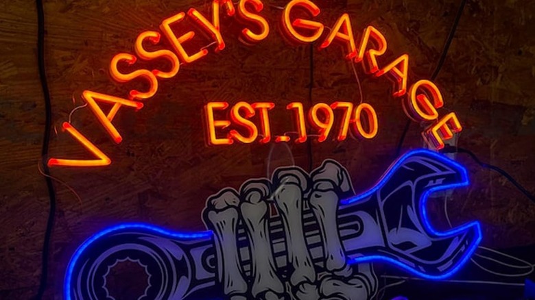 Customized waterproof neon-style sign with orange lettering and blue outlining