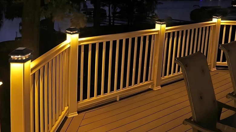 Wooden deck with solar-powered light-up post caps installed