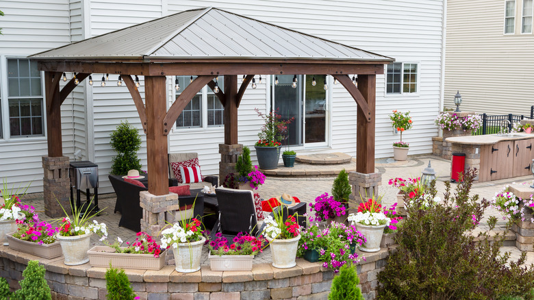 wooden gazebo with metal roof