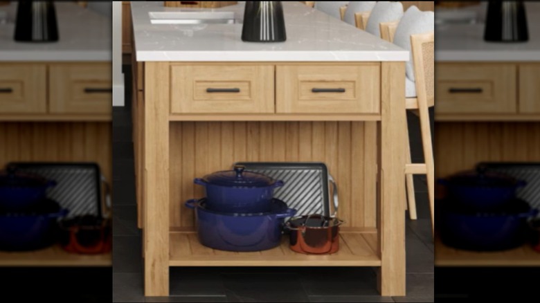 A kitchen island end cap with a plate shelf