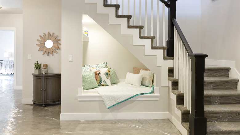 reading nook built under stairs