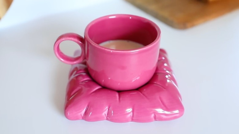 Pink mug on coaster