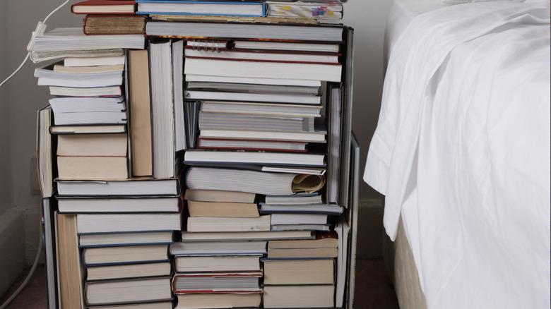 bedroom nightstand made from stacks of books