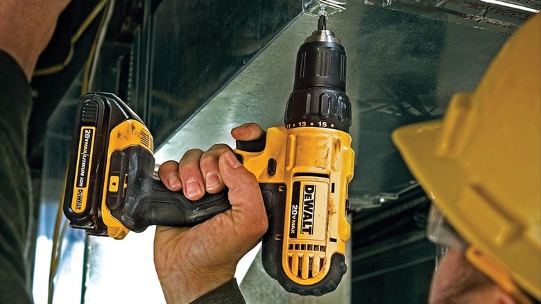 Man using DeWalt 20V Max Cordless Drill Driver Set
