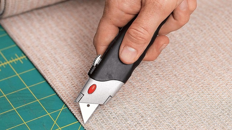 hand cutting fabric material with Internet's Best Utility Knife