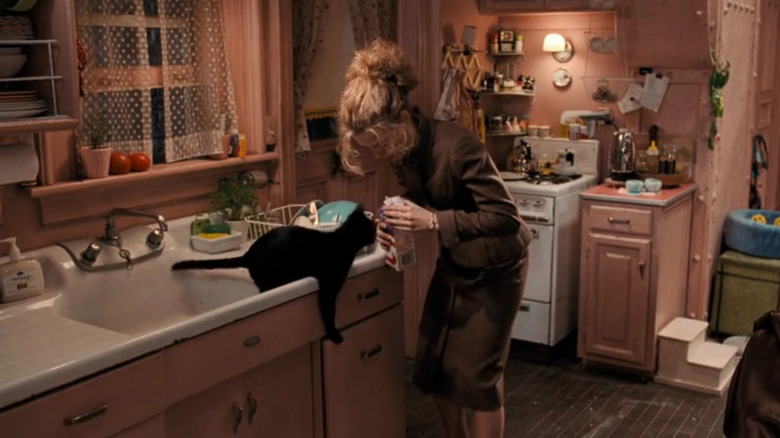 Michelle Pfeiffer as Selina in her pink kitchen in Batman Returns (1992)