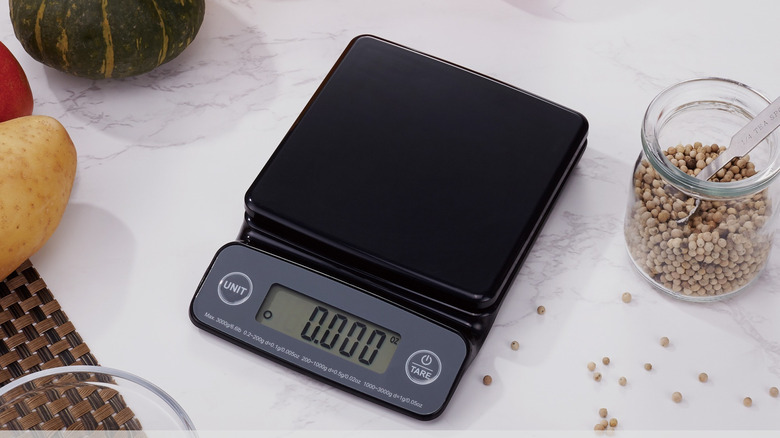 Digital kitchen scale with a bowl being weighed