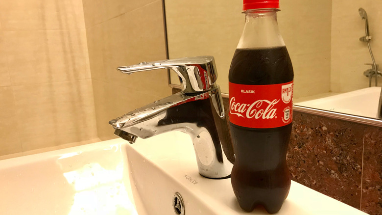 bottle of soda on sink