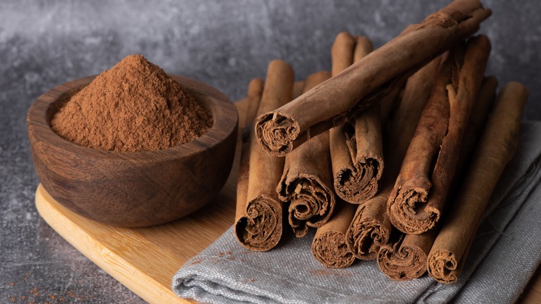 ground cinnamon and cinnamon sticks