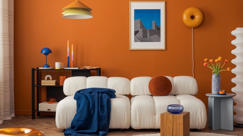 Living room with orange paint on the walls