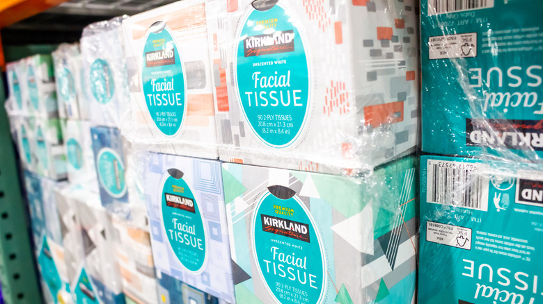 Stacks of Kirkland facial tissues in a Costco store