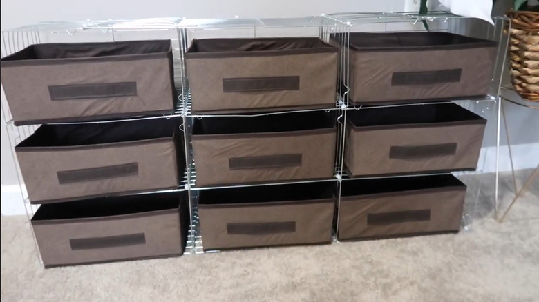 Shelving created from cooling racks with fabric drawers.