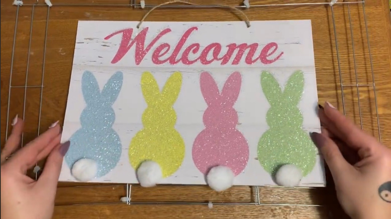 Cut cooling rack pieces that form a frame around a sign.