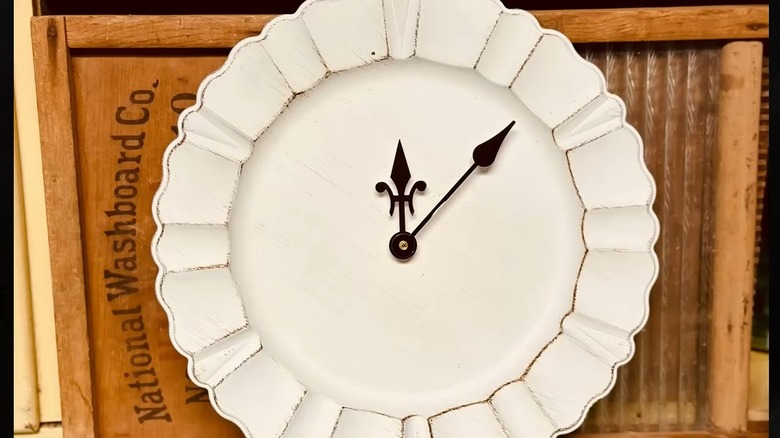 White charger plate turned into a clock with an antique washboard behind it