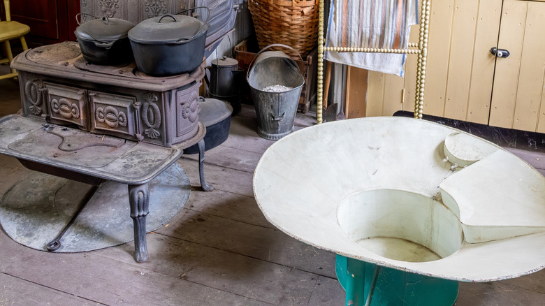 Old-school cast-iron, coal-fired stove in an old kitchen