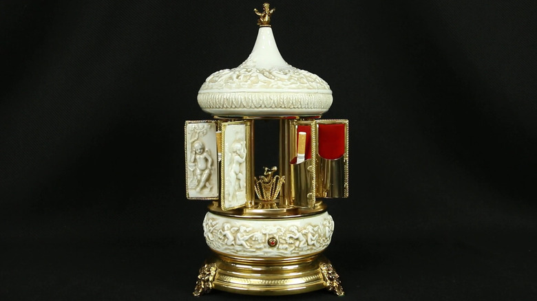 Antique musical cigarette dispenser