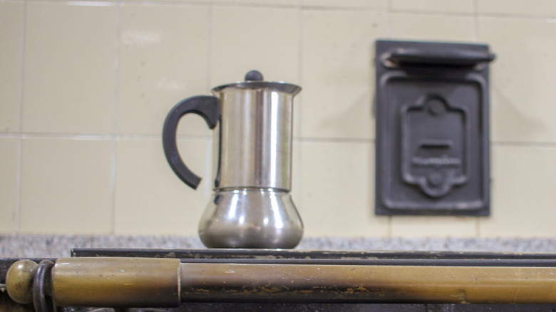Stovetop coffee percolator sitting on an old stove