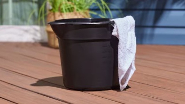 Black plastic bucket with handles