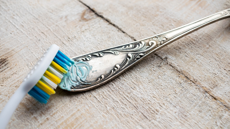 Close up of toothbrush and toothpaste polishing utensil