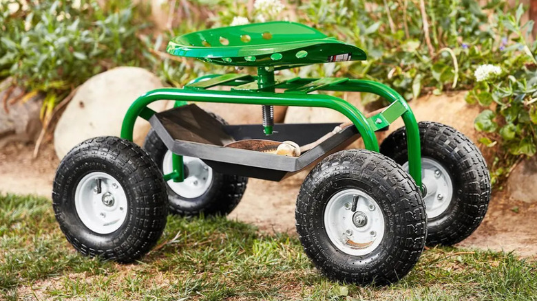 A rolling garden bench with a tool tray.