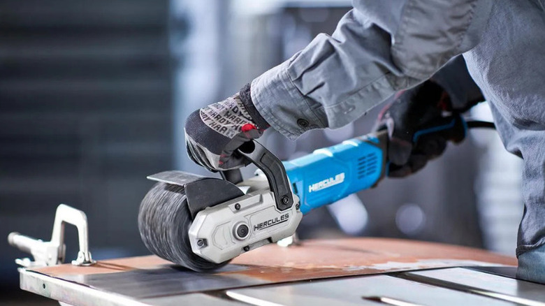 A man using a surface conditioner made by Hercules