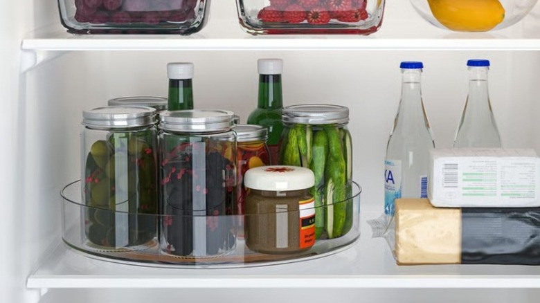 Lazy Susan inside a fridge with various jars