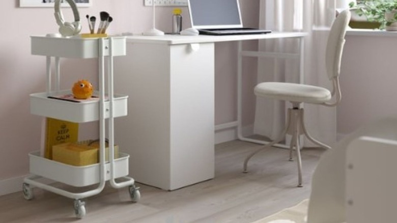 Ikea trolley storage with paintbrushes and other hobby items