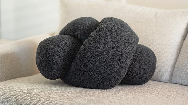 The Kirkton House Giant Knot Pillow, a gray twisted pillow