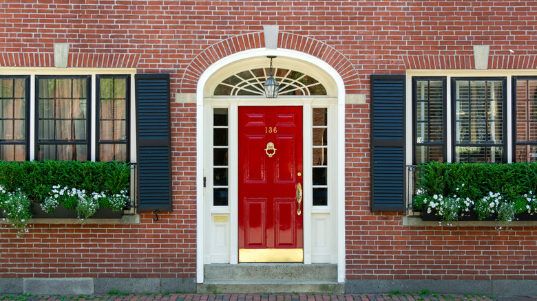 Red front door with glass framing
