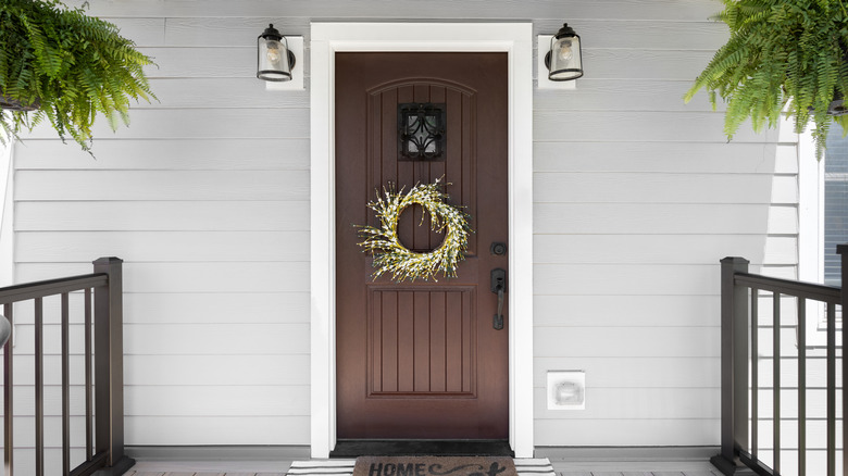 Front door with vinyl siding