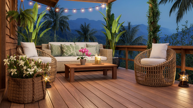 A home's fully finished wood deck with patio furniture