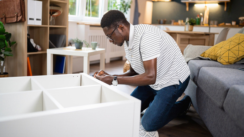 Person putting together furniture