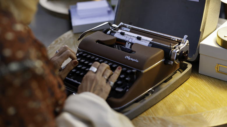 Person using vintage typewriter