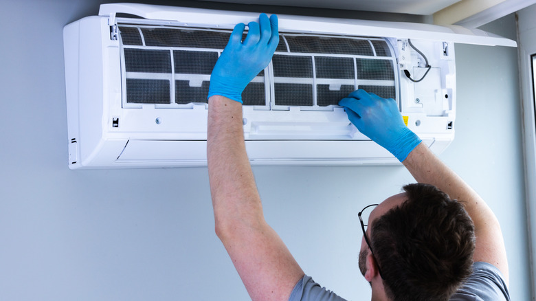 HVAC technician working in home