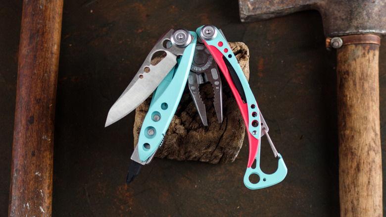 Old tools around a turquoise multi tool