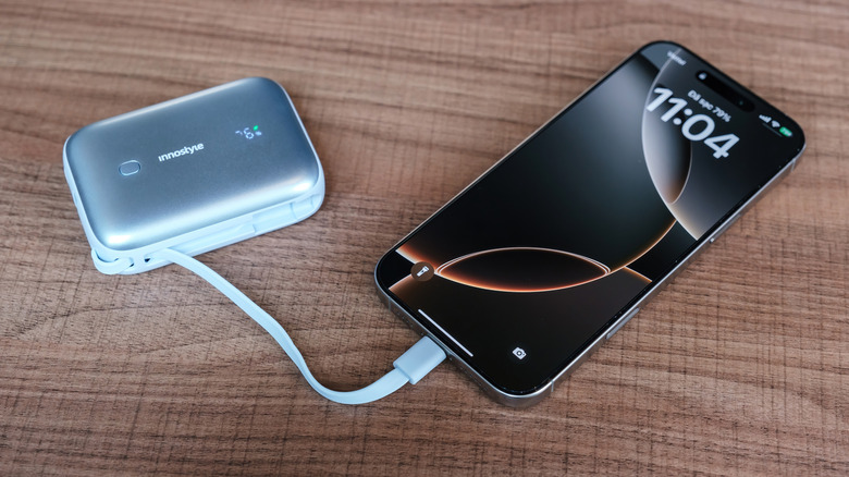 Phone connected to a mini power bank