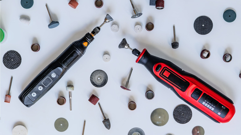 Overhead shot of two cordless rotary tools and bits