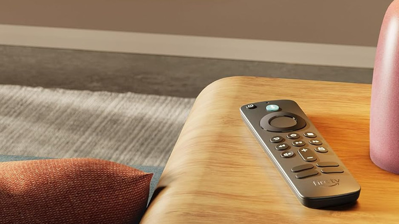 Smart TV remote sitting on modern wood end table in luxurious living room