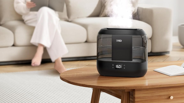 Smart humidity mister on coffee table in expensive living room